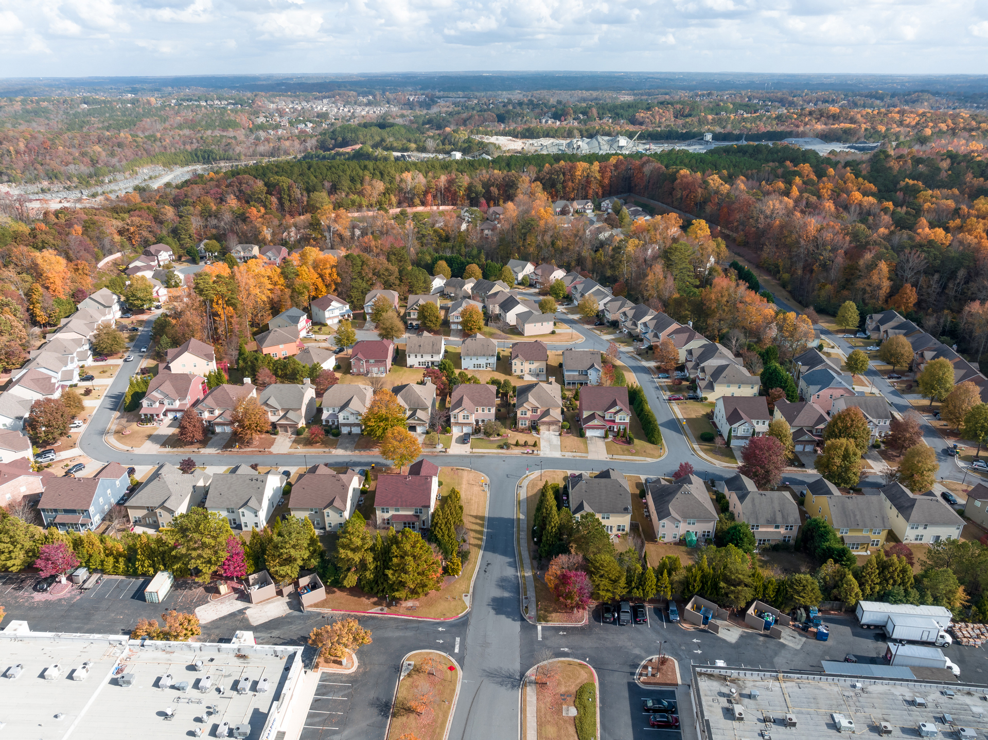 Aerial view Atlanta suburbs next to highway 400 during the Fall in the Golden hour